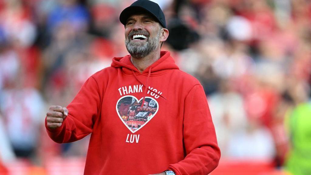 Klopp wore a top with the words 'I'll Never Walk Alone Again' on the back