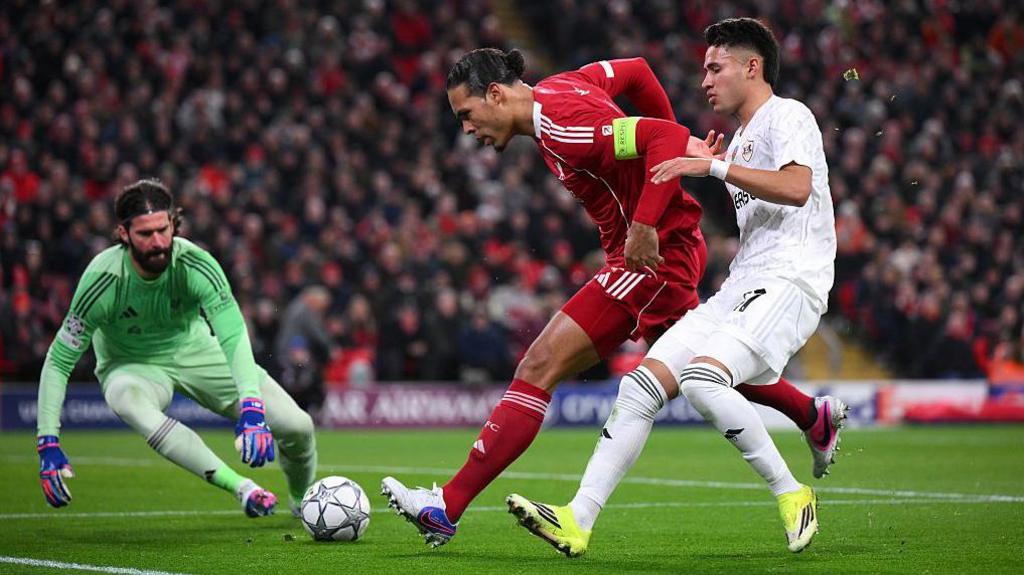 Virgil van Dijk of Liverpool is challenged by Camilo Duran of Qarabag FK during the UEFA Champions League 2025/26 