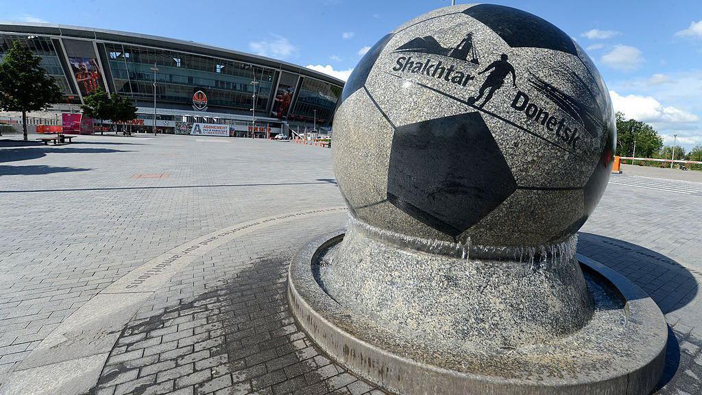 A football statue outside the Donbas Arena in Donetsk