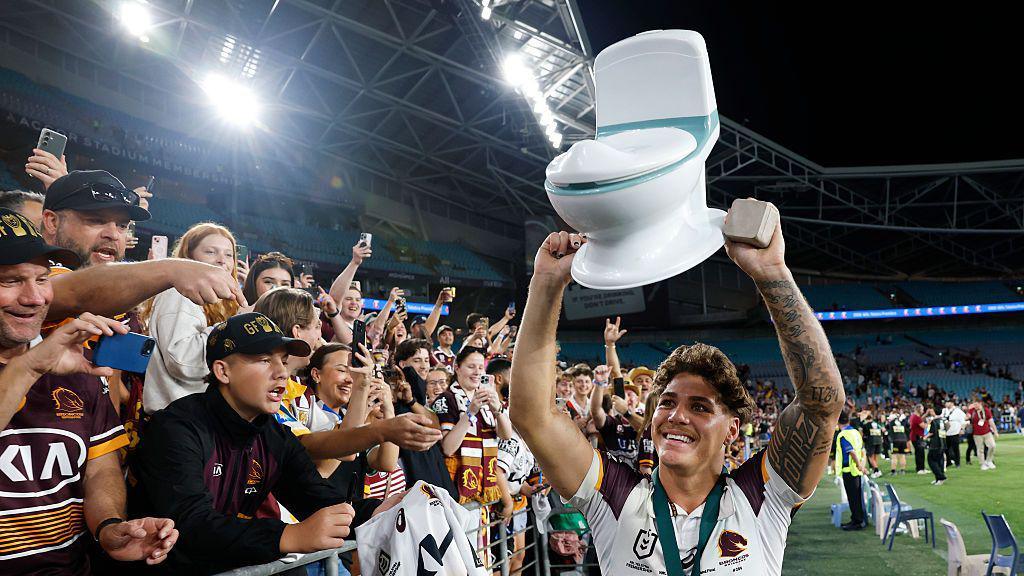 Walsh celebrates with a toilet