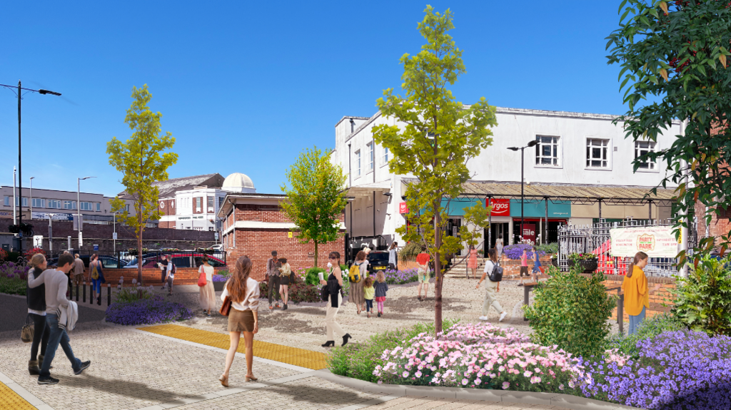 An artist's impression of Workington public realm improvements. Flower beds and thin green trees are superimposed onto a pedestrianised plaza in front of an Argos store.