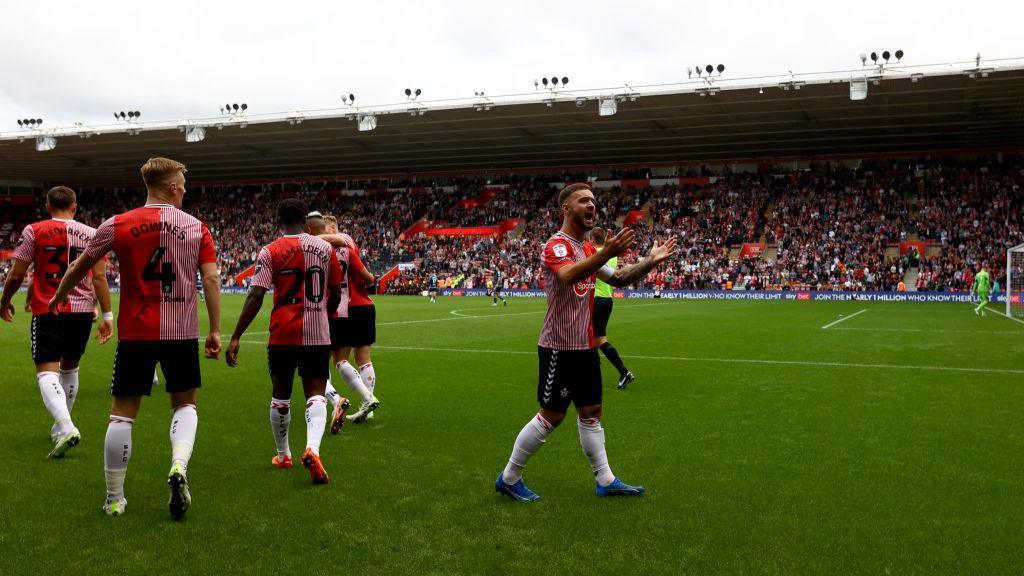 Adam Armstrong of Southampton celebrates scoring against Leeds