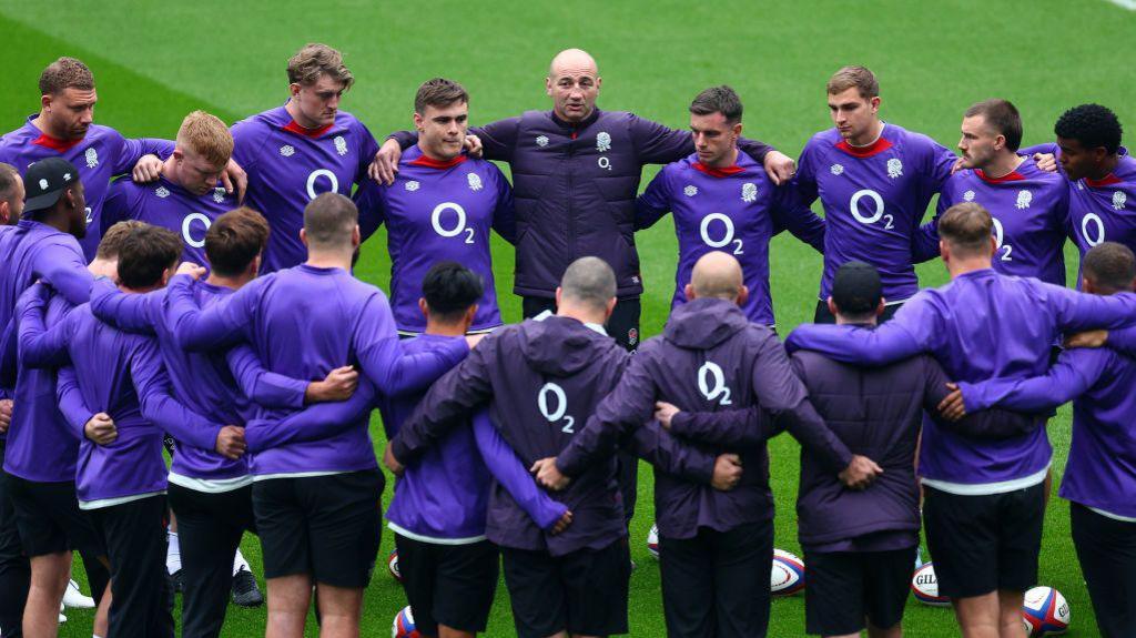 Steve Borthwick surrounded by England players