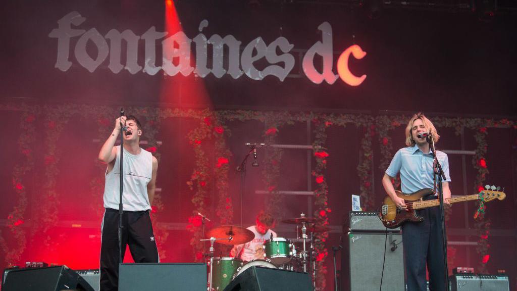 Grian Chatten of Fontaines DC performs during Rock en Seine Festival on August 25, 2022 in Saint-Cloud, France.