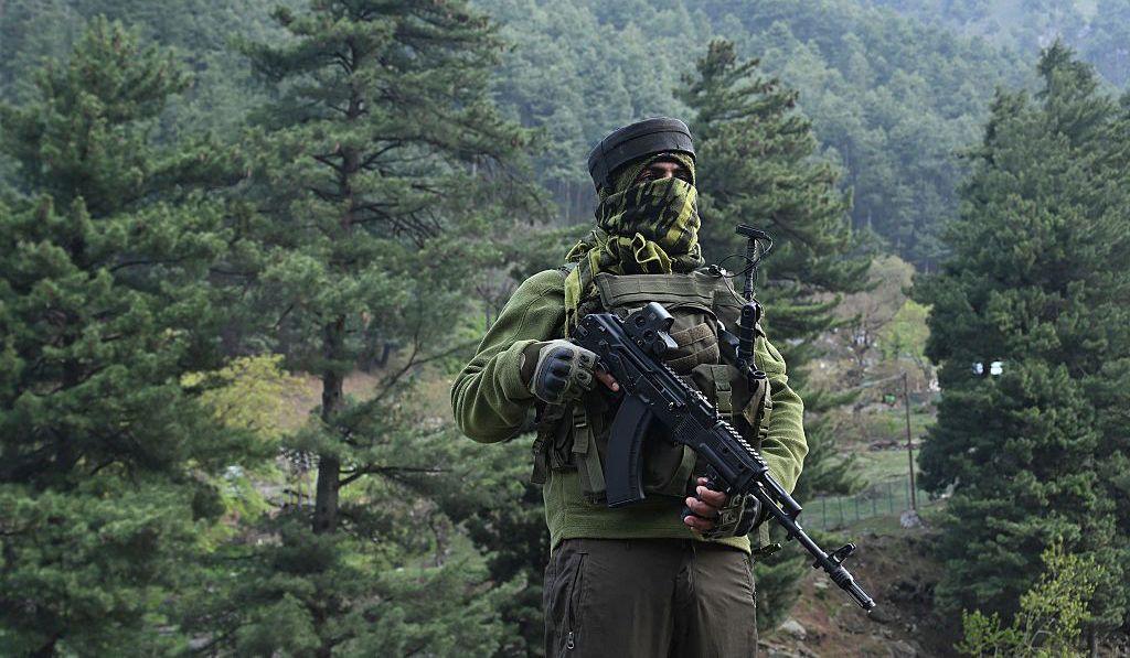An Indian paramilitary serviceman keeps watch in Pahalgam, south of Srinagar on April 23, 2025, following an attack. 