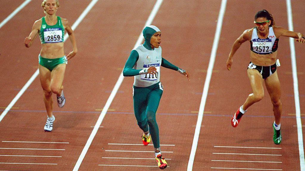 Cathy Freeman crosses the finish line of a race