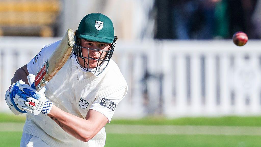 Daniel Lategan plays a shot and watches the ball fly away during an innings for Worcestershire
