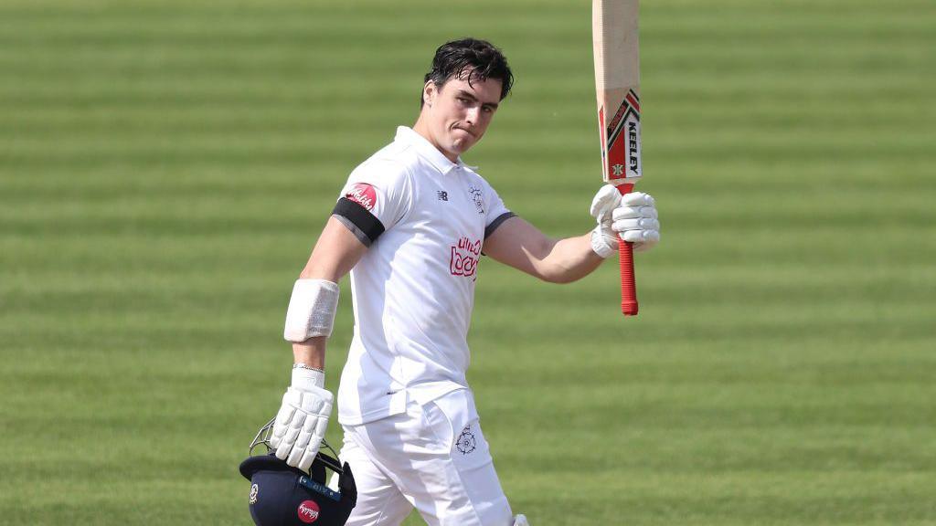 Ali Orr of Hampshire celebrates reaching his century during the Vitality County Championship match between Hampshire and Durham at the Utilita Bowl