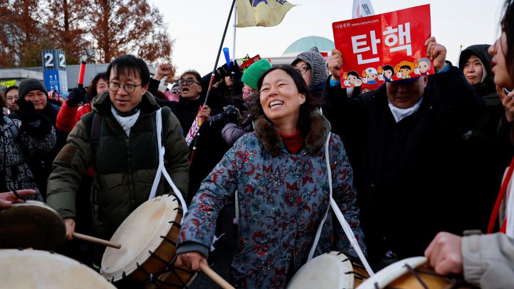 Protesters celebrate MPs vote to impeach South Korean President Yoon Suk Yeol