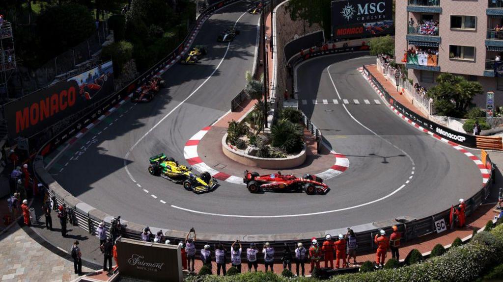 Ferrari's Charles Leclerc leading McLaren's Oscar Piastri around Loews hairpin during the 2024 Monaco Grand Prix