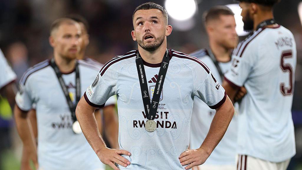John McGinn of Aston Villa looks dejected after the team's defeat in the UEFA Super Cup