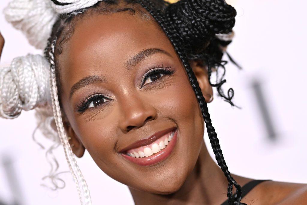 A close-up of Thuso Mbedu with white and black braids smiling at the Dolby Theatre, Hollywood - Monday 9 December 2024 