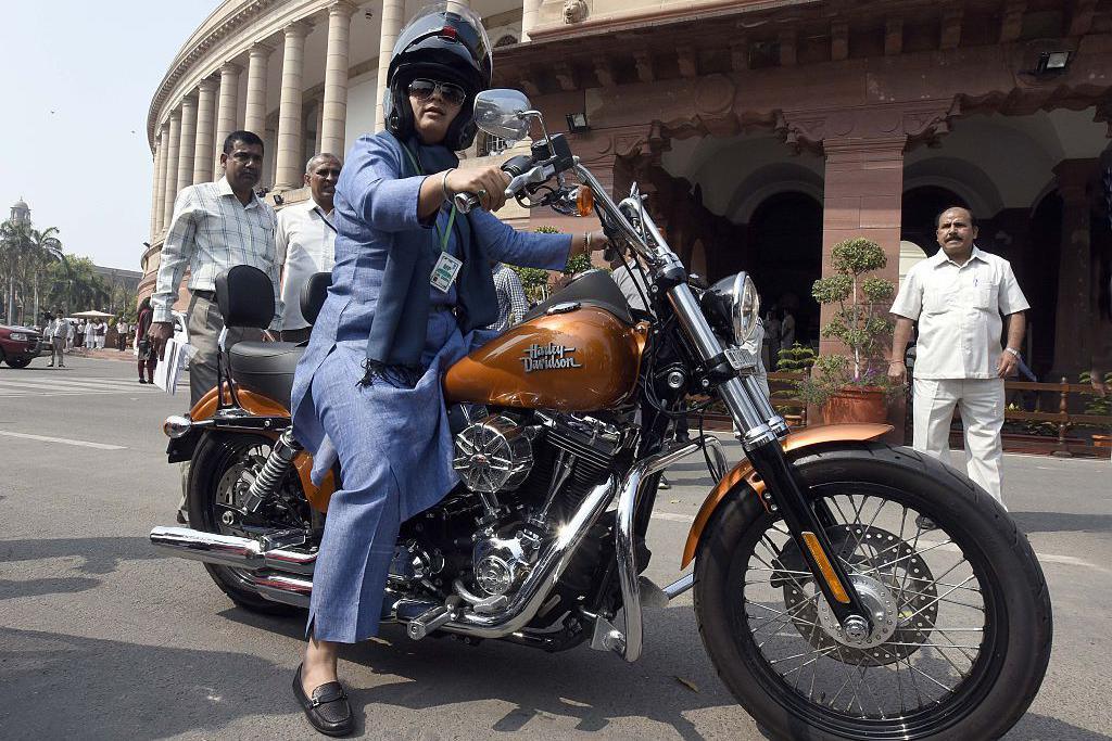 Ranjeet Ranjan, Congress party MP from Supaul, Bihar and wife of Pappu Yadav arrives at Parliament House on her Harley Davidson bike