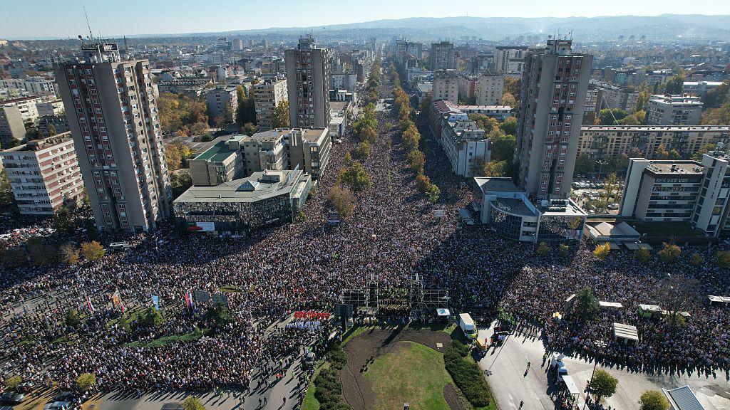 An aerial view of thousands gather to commemorate the 16 people who lost their lives in the train station accident on November 1, 2024, when a concrete canopy collapsed, and to protest against the government in Novi Sad, Serbia on November 1, 2025.