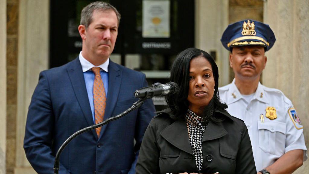 Dr Myriam Rogers (centre), superintendent of Baltimore County Public Schools, and Police Chief Robert McCullough (right) speak at a press conference