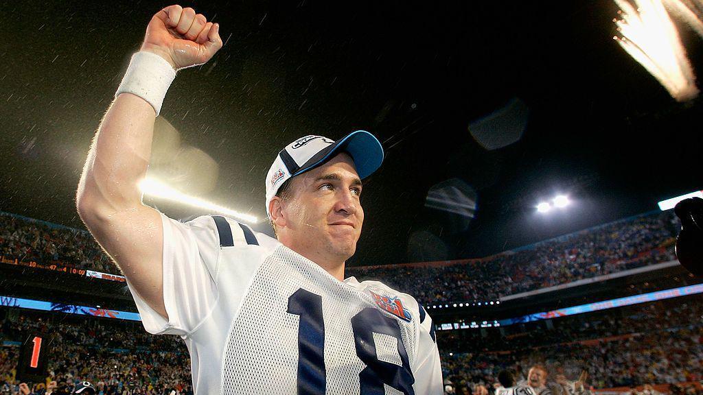 Peyton Manning raises one fist in there in celebration, with fireworks going off in the background, after winning Super Bowl XLI with the Indianapolis Colts in 2007