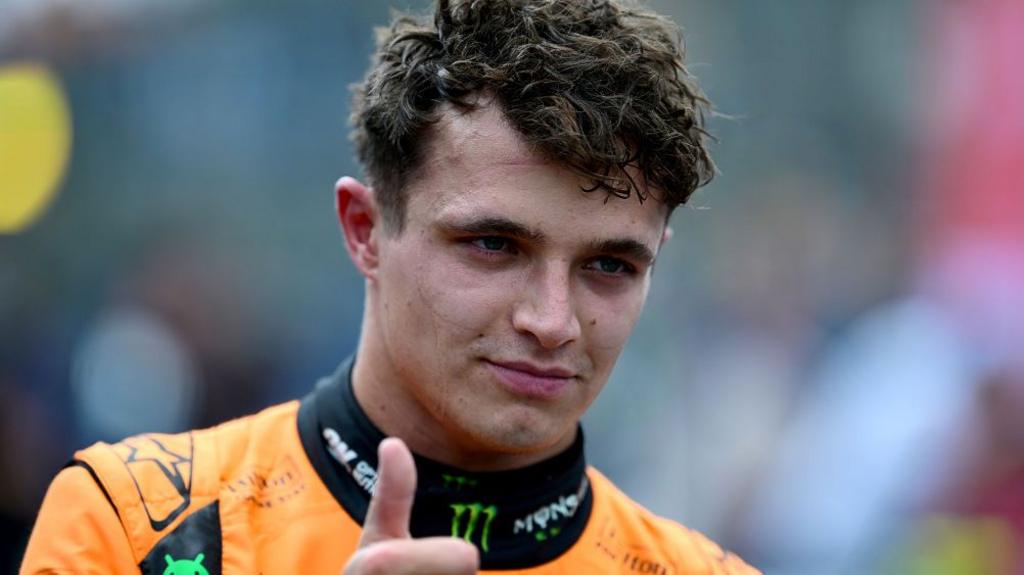 Lando Norris gives the thumbs-up signal after winning the Sao Paulo Grand Prix sprint race