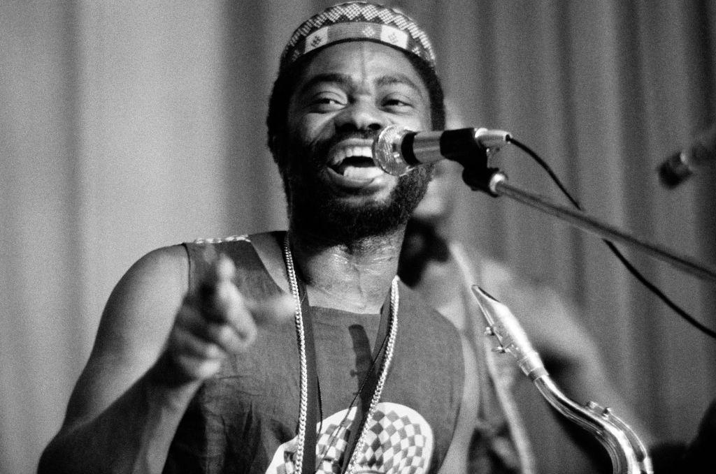 A black-and-white picture of young Teddy Osei singing in 1974 