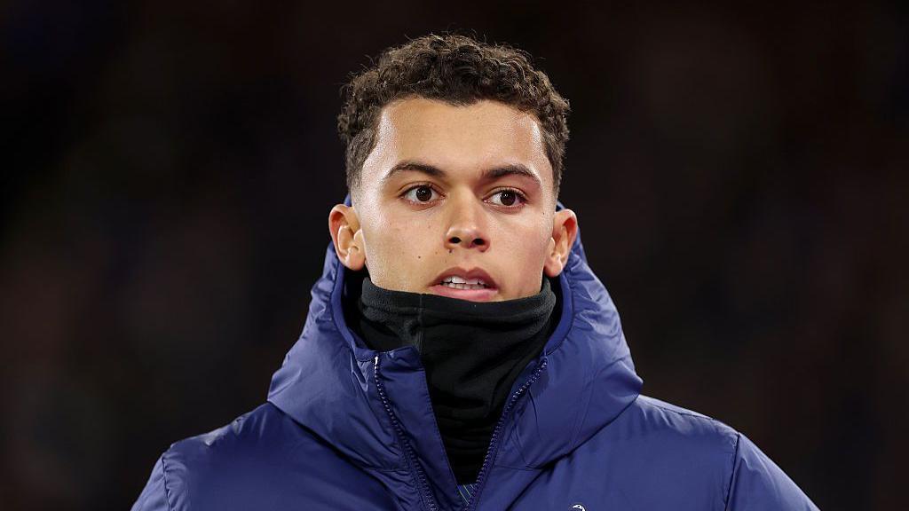 Brennan Johnson wearing a coat and snood