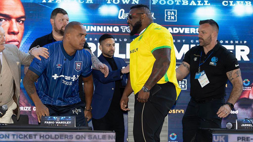 Fabio Wardley rises from his seat with Jarrell Miller coming towards him