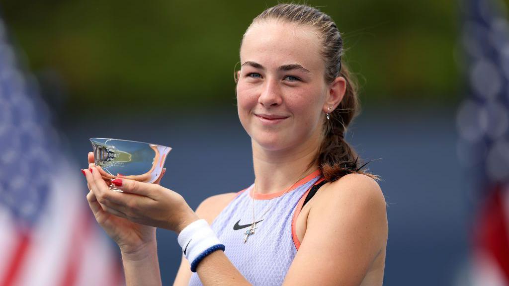 Mika Stojsavljevic holds the US Open girls' trophy