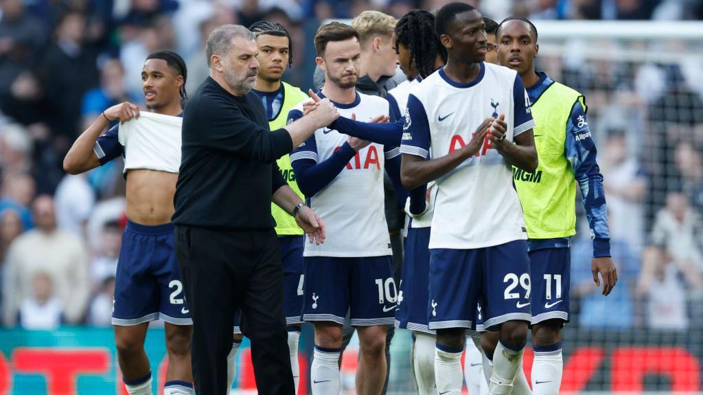 Ange Postecoglou shakes hands with his Tottenham players after they draw with Bournemouth