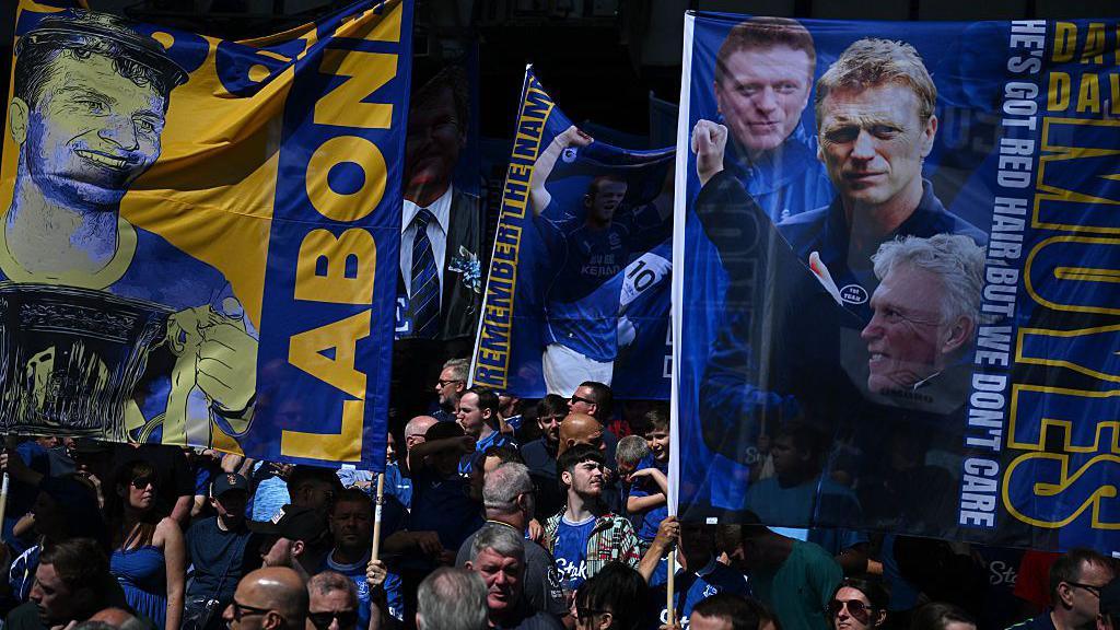 Everton fans hold up banners at Goodison Park