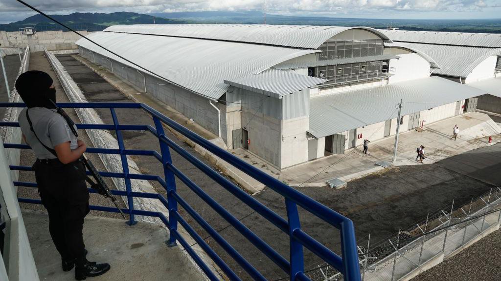 A prison officer monitors the cell blocks inside from a tower at Cecot in Tecoluca, El Salvador