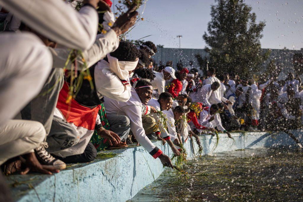 People from the Oromo community splash themselves with water to celebrate 'Irreecha' in Addis Ababa.