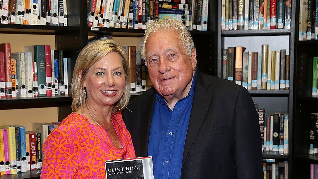 Retired U.S. Secret Service Agent Clint Hill (R) and Lisa McCubbin attend a booksigning for "Five Presidents" at Blue Willow Bookshop on August 13, 2016 in Houston, Texas.