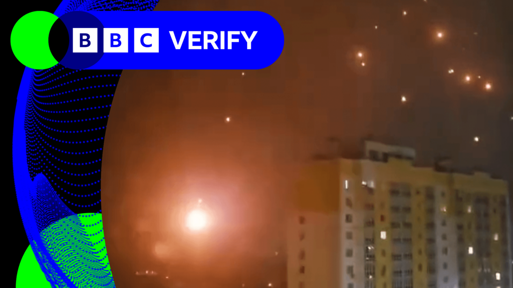 Footage shared on Telegram and X showing burning debris falling against the night sky with a residential tower block in the middle ground