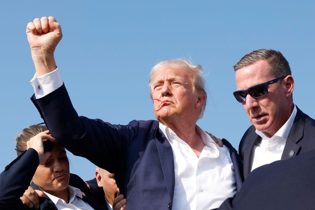 Republican presidential candidate former President Donald Trump is rushed offstage during a rally on July 13, 2024 in Butler, Pennsylvania. 