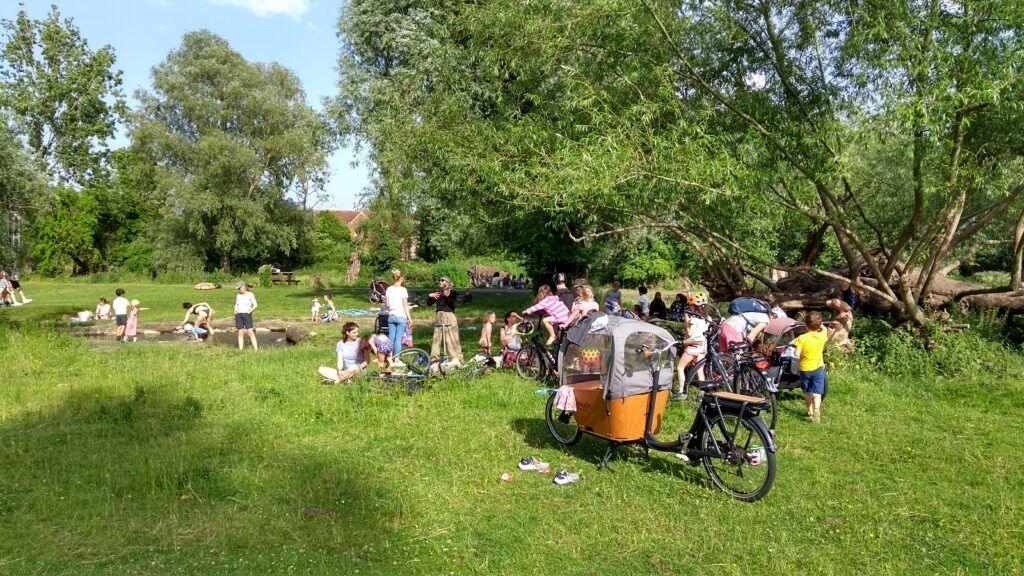 People enjoying the river in 2023