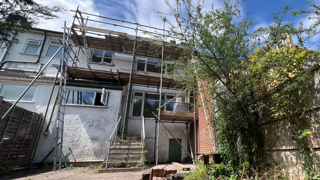 The back of the house - it is two stories high and covered in scaffolding as work is ongoing to bring it back into use.