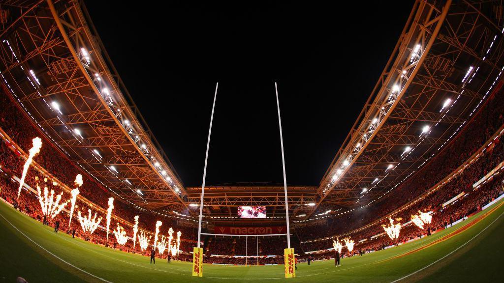 An internal shot of the Principality Stadium in the dark with flames shooting up
