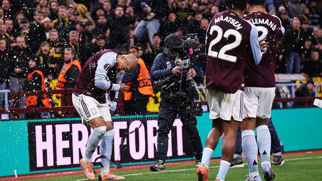Donyell Malen gets his by a plastic cup thrown from the away end