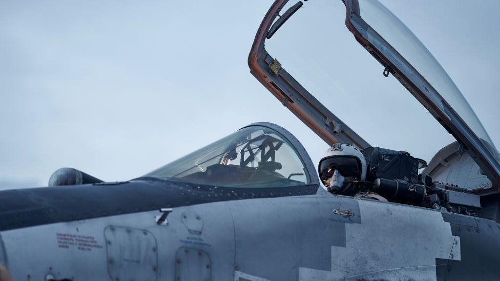 A Ukrainian pilot sits in a MiG-29 in eastern Ukraine in 2023