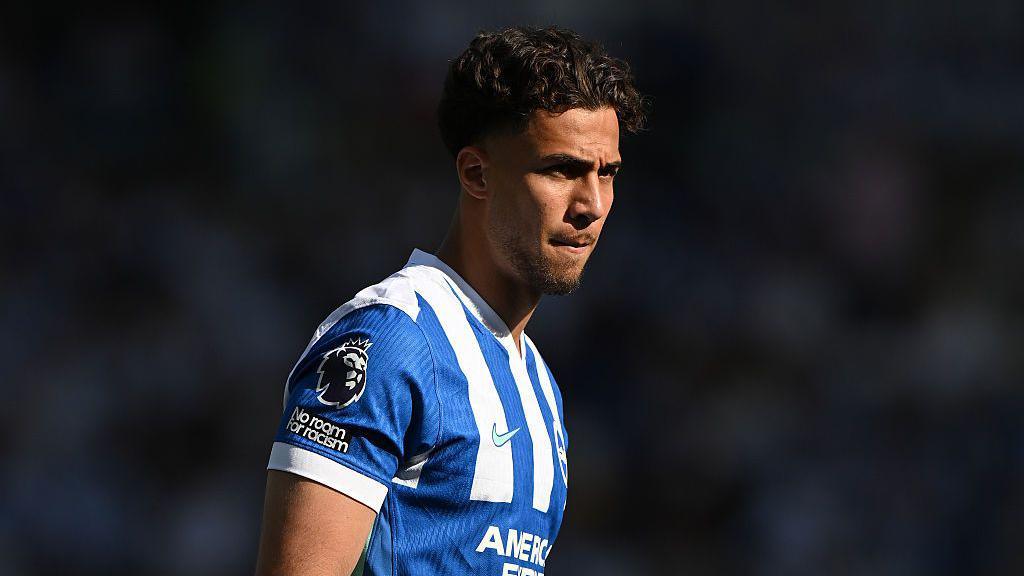 Charalampos Kostoulas of Brighton looks on