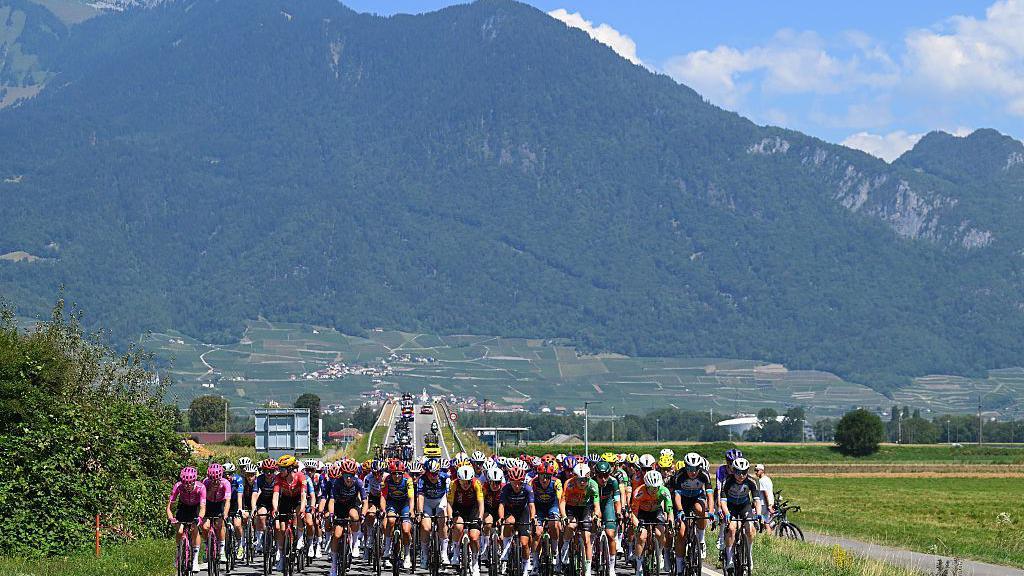 A general view of the peloton passing through a landscape during the 5th Tour de France Femmes 2026
