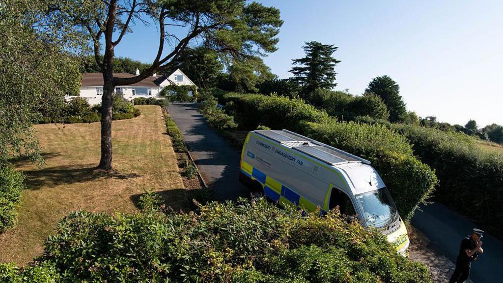 Ann Widdecombe's home, police in front of the driveway.