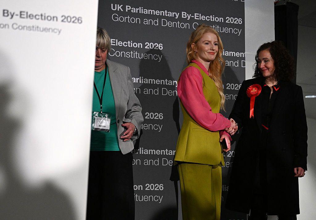 Green candidate Hannah Spencer (left) shakes the hand of Labour's Angeliki Stogia (right).