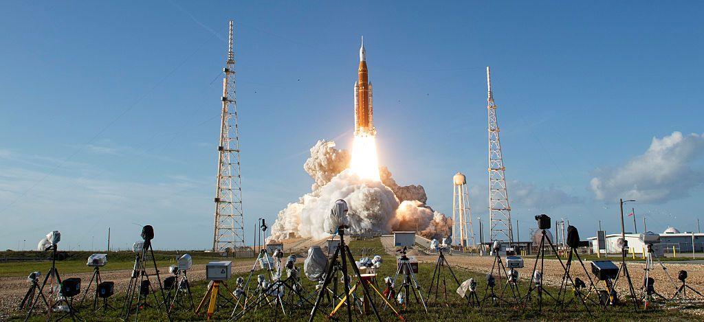 Nasa's Space Launch System rocket carrying the Orion spacecraft blasts off.