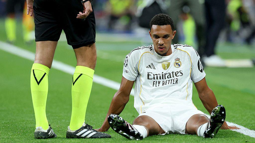 Trent Alexander-Arnold reacts on the ground
