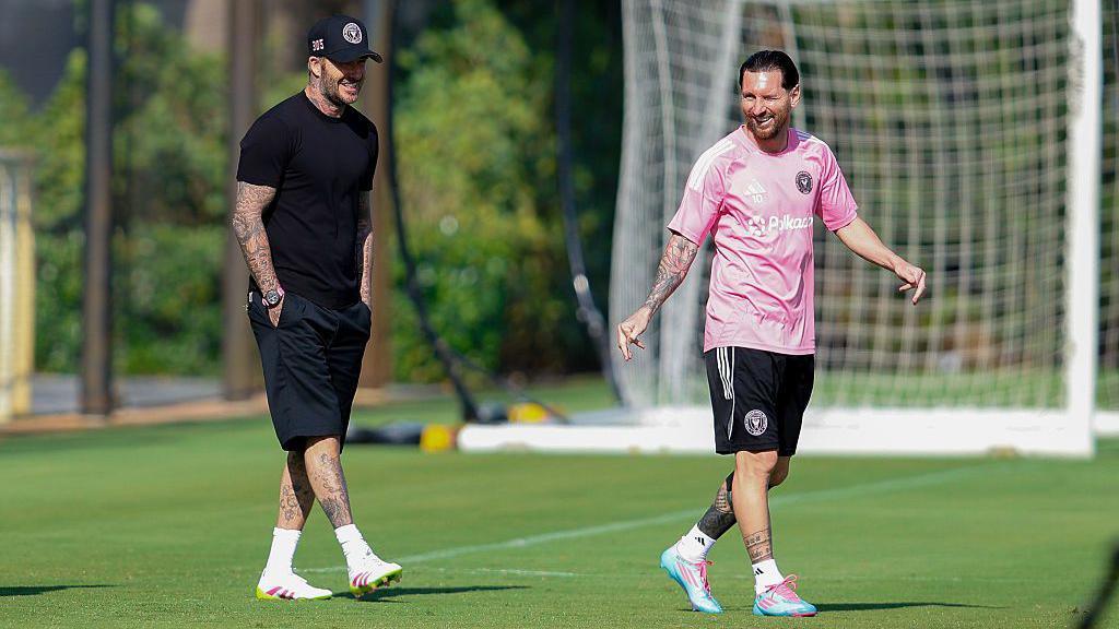 David Beckham and Lionel Messi on the training pitch together.