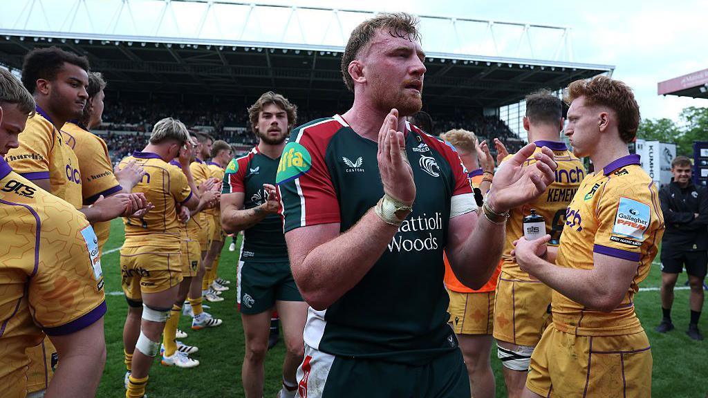 Ollie Chessum, the Leicester Tigers captain, leads his team off the field after their victory over Northampton Saints at Mattioli Woods Welford Road Stadium