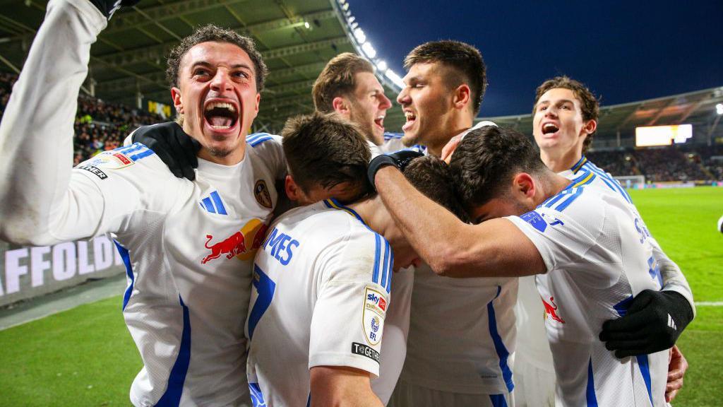 Dan James is mobbed as Leeds celebrate a goal