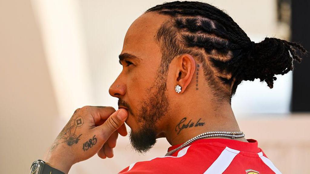 Ferrari's Lewis Hamilton looks on during testing in Bahrain