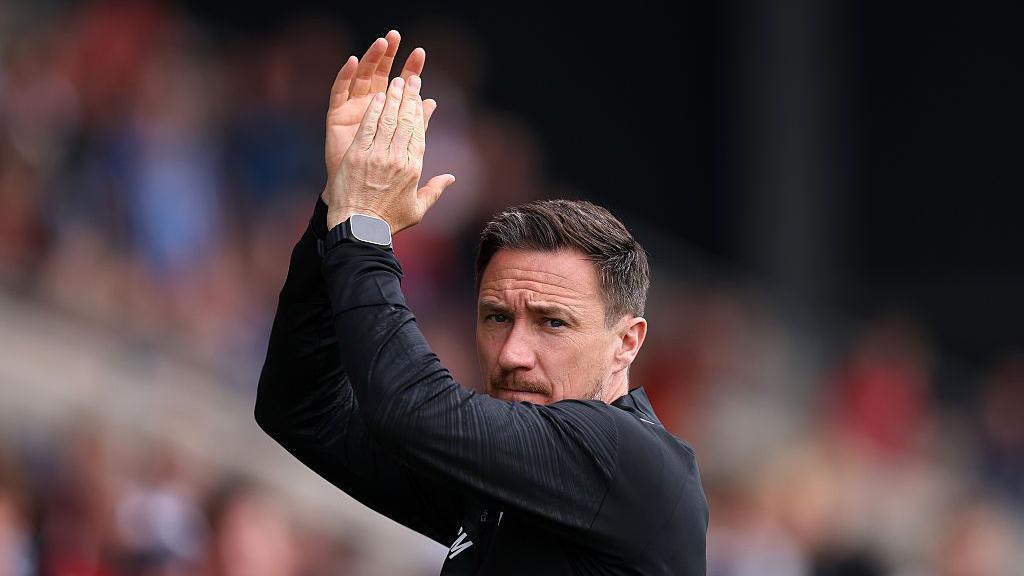 Stuart Maynard applauds the York fans prior to a pre-season friendly 