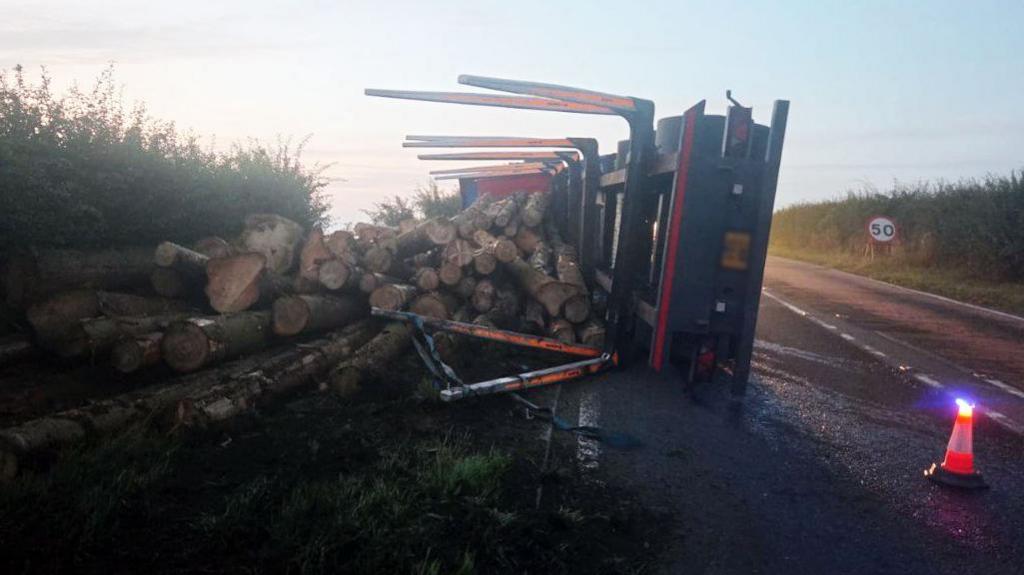 Lorry with shed load of logs on A617