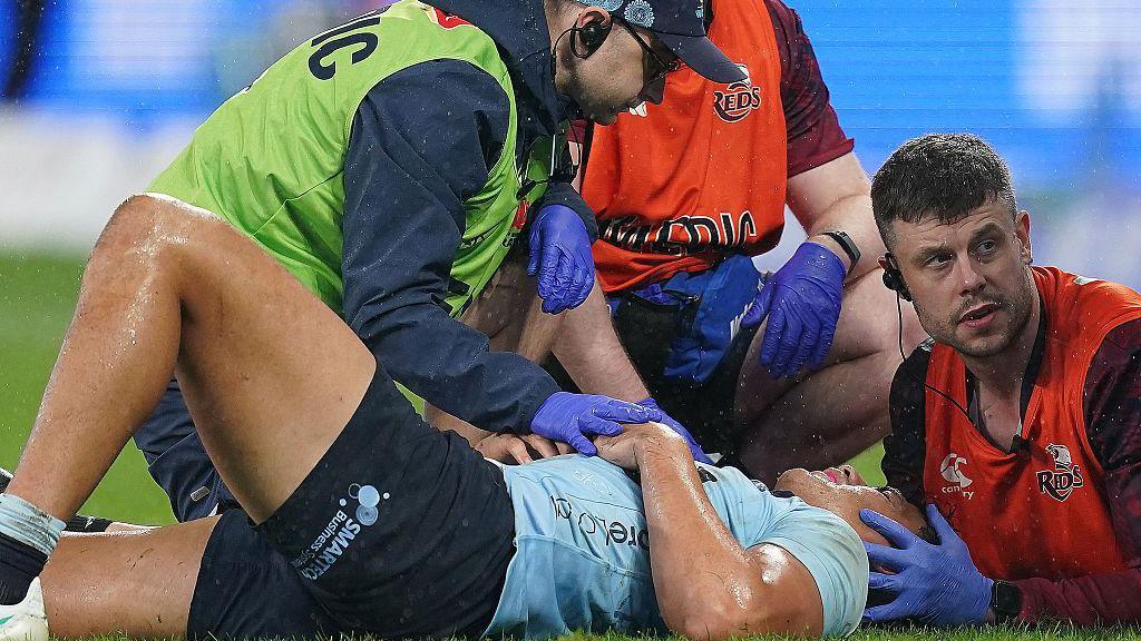 Joseph-Aukuso Suaalii is treated for concussion while playing for the Waratahs